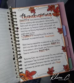 an open notebook with the words thanksgiving written on it and flowers in orange, pink and blue