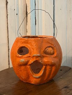 an orange halloween pumpkin with its mouth open