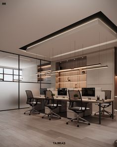 an office space with desks and chairs in it