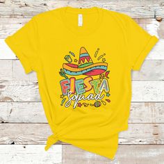 a t - shirt with the word fiesta spread in colorful lettering and a sombrero