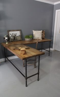 two wooden tables sitting on top of a white floor next to each other in a room