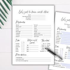 two printable wedding checklists on top of each other next to a pen and palm leaf