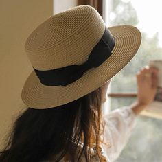 Stay cool and stylish with our classic straw boater hat. Crafted from high-quality, breathable straw, it features a wide brim for excellent sun protection and a chic black ribbon band. The lightweight design ensures comfort, making it perfect for garden parties, beach outings, and casual strolls. Elevate your look with this elegant and functional accessory. Size: M: 56-58cm & L: 58-60cmStyle: CasualBrim Style: Wide brimCrown Design: Round crownShape: FlatDesign Details: Bowknot Adjustable Flat Cap Hats For Summer, Casual Flat Cap For Summer, Casual Summer Flat Cap, Adjustable Flat Cap For Beach, Summer Flat Cap For Outdoor, Summer Outdoor Flat Cap, Spring Beach Flat Cap, Casual Flat Cap Straw Hat For Summer, Casual Brimmed Boater Hat