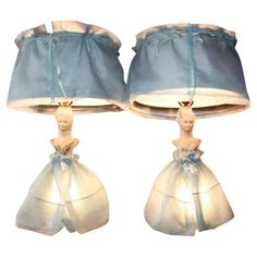 two lamps that have been made to look like dolls