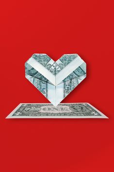 DESIGNED BY: JESUS BETANCOURT
Check out this cool origami heart made out of a dollar bill.
This isn't just any dollar bill. It's been transformed into a beautiful origami heart, symbol of love and creativity.