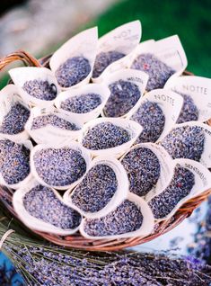 a basket filled with lavender seeds on top of a table