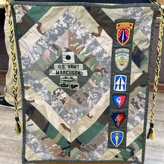 an army bag with many patches on it