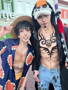 two young men are dressed up in costumes