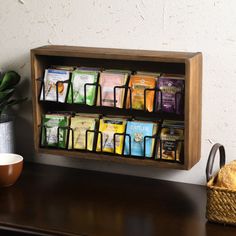 a shelf filled with lots of different types of items on top of a wooden table