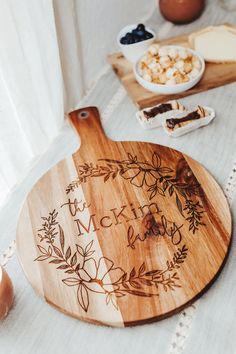 a wooden cutting board sitting on top of a table