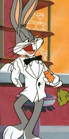 an animated rabbit in a tuxedo holding a carrot