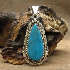 (eBay) This is a lovely sterling silver pendant with a bright blue turquoise stone. The teardrop-shaped stone is 16x37mm and is bordered with a twisted wire, stamped and sawn decorative edge. The back of the pendant is stamped Sterling and carries the hallmark "SY". Spiritual Sterling Silver Turquoise Pendant Necklace, Nickel-free Southwestern Blue Turquoise Necklace, Southwestern Style Blue Turquoise Nickel-free Necklace, Southwestern Style Nickel-free Blue Turquoise Necklace, Western-style Sterling Silver Turquoise Pendant Necklace, Zuni Jewelry, Southwest Jewelry, Twisted Wire, American Southwest