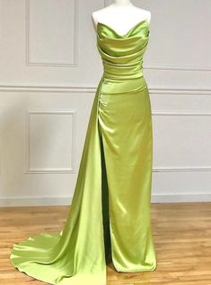 Chic in its design, does this gown not beckon the bold and the beautiful? The radiant chartreuse satin, structured yet fluid, flows down in a tailored fit that speaks of haute couture's precision. The bodice, with its artful ruching, accents the natural lines of the figure, while the expansive skirt and train provide a dramatic counterbalance, full of movement. The minimalist approach to the gown allows the vibrant color and exquisite fabric to take center stage, making it the ideal choice for those who wish to embody elegance with a touch of contemporary flair.Silhouette:mermaidHemline:floor lengthNeckline:straplessFabric:satinShown Color:greenSleeve Style:sleevelessBack Style:zipper upEmbellishment:pleatsBuilt-in Bra: yes Tianas Closet, Prom Dresses Long Pink, Long Formal Gowns, Evening Dress Floor Length, Prom Dresses Vintage, Mermaid Style, A Line Prom Dresses, Sweet 16 Dresses, Satin Prom Dress