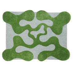 a rug with green and white shapes on it