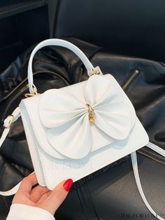 BagForLove - Chic Crossbody Handbag with Butterfly Bow Decoration for Trendy Fashionistas Product Description Color White Type Square Bag Bag Size Mini Pattern Type Plain Coating 100% Polyurethane Composition 100% Polyurethane Material PU Leather Size Chart INCH CM Strap Length Bag Length Bag Width Bag Height Handle Height 44.1 inch 7.9 inch 2.8 inch 5.9 inch 3.9 inch Strap Length Bag Length Bag Width Bag Height Handle Height 112 cm 20 cm 7 cm 15 cm 10 cm Details Pictures Similar Products h2 { text-align: center; } /* æ¢è¡ */ li{ white-space: normal; word-break: break-all; word-wrap: break-word; } .red-box { width: 100%; display: flex; flex-direction: row; flex-wrap: wrap; justify-content: center; } .red-box > div { width: 190px; height: 250px; margin: 10px; } .red-box > div > a > img { White Double Handle Satchel As Gift, Party Crossbody Bag With Single Handle, Single Handle Crossbody Bag For Party, Single Handle Crossbody Party Bag, Feminine White Shoulder Bag With Top Handle, White Feminine Top Handle Shoulder Bag, Feminine White Top Handle Shoulder Bag, Chic White Party Bags, Trendy White Box Bag With Handles