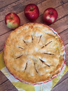 an apple pie on a table with apples around it and the words best apple pie recipe ever