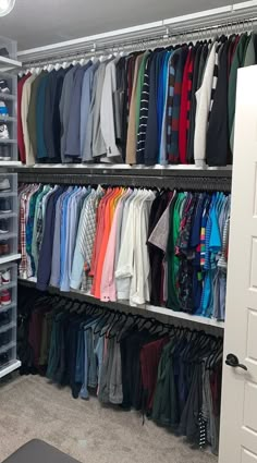 the closet is full of shirts and pants