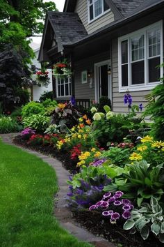 Mixed Garden Bed, Rounded Flower Bed Ideas, Flower Garden Front Of House, Garden Bed Layout Flowers, Colorful Front Landscaping, Pretty Yard Ideas, Wild Flower Garden Front Yard, Shade Landscaping Ideas Backyards, Foundation Plants For Front Of House