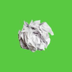 a ball of crumpled paper on a green screen