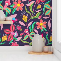 the wallpaper is colorful and has flowers on it, as well as vases