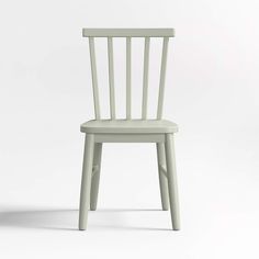 a light green chair with a white seat and back rest on a plain surface, viewed from the front