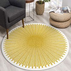 a yellow and white rug in the middle of a living room with a gray chair