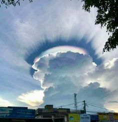 a rainbow in the sky over some buildings