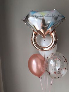 balloons and heliums in a vase with an congratulations balloon on the top that says, happy birthday