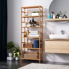 the bathroom is clean and ready to be used as a storage unit for towels, soaps, and other personal care items