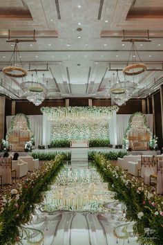 an elegant wedding setup with flowers and greenery