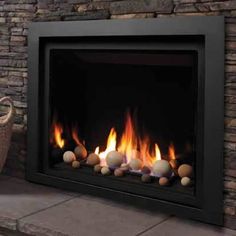 a fire place that has some balls on it