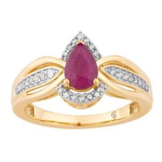 a yellow gold ring with a pear shaped ruby and white diamonds