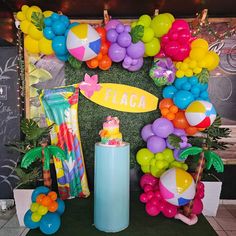 an assortment of balloons and decorations for a birthday party