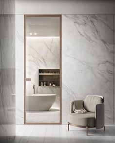 an elegant bathroom with marble walls and flooring is shown in this image, there is a chair next to the bathtub