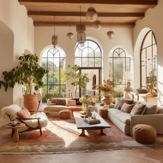 a living room filled with lots of furniture and large windowed windows next to each other