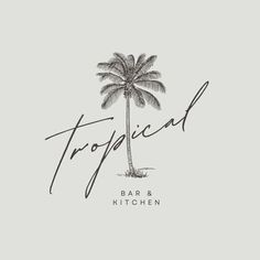 a palm tree with the words tropical bar and kitchen written in cursive font