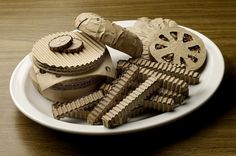 there are some cookies that have been cut into pieces on the plate and placed on top of each other