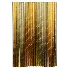 gold foiled paper straws are stacked on top of each other, and the background is