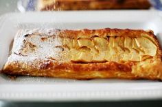 some food on a white plate with powdered sugar