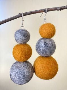 Introducing our beautiful handmade felted wool pom pom earrings with sterling silver ear wires! These earrings are crafted with care, using only the finest materials to ensure their quality and longevity. The pom poms are made of soft, high-quality wool that is felted by hand in a variety of vibrant colors, giving each pair of earrings a unique and eye-catching look. The sterling silver ear wires are hypoallergenic, providing a comfortable and secure fit for sensitive ears. Lightweight and easy to wear, these earrings are perfect for adding a pop of color and texture to your everyday look, or for dressing up a special occasion outfit. They also make a thoughtful and unique gift for someone you love. With their handmade craftsmanship and timeless design, these felted wool pom pom earrings a Felting Earrings, Wool Earrings, Wool Jewelry, Felt Earrings, Felted Earrings, Pom Earrings, Large Dangle Earrings, Occasion Outfit, Pom Pom Earrings