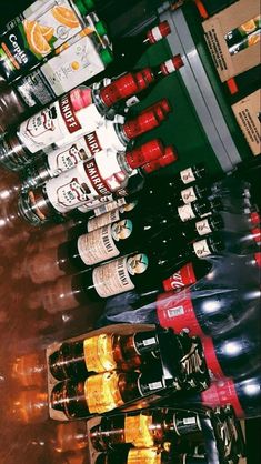 several bottles of beer are lined up in a row