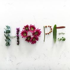 the word love spelled out with flowers and leaves