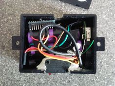 the inside of a box with wires in it