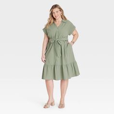 Take on any day in cool style donning this Short-Sleeve Tiered Midi Shirtdress from Ava & Viv™. Made of lightweight gauze cotton, this midi dress is tailored with a collared neckline featuring a full-length button placket down the front, short dolman sleeves with rolled cuffs and functional side pockets. A sash-tie belt for cinching your waist and a tiered hem for a frilly finish complete the look. Pair it with your fave accessories and sandals for an outfit that will be sure to impress. Flowy Short Sleeve Shirt Dress For Daywear, Casual Flowy Short Sleeve Shirt Dress, Flowy Casual Shirt Dress With Short Sleeves, Casual Flowy Shirt Dress With Short Sleeves, Green Dresses Casual, Olive Green Dress Casual, Light Olive Green, Maxi Bodycon Dress, Green Dress Casual