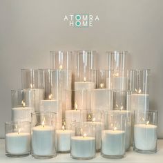 a bunch of candles that are sitting on a table