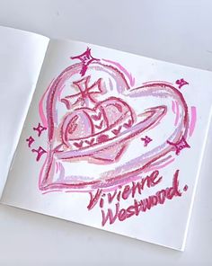 an open book with drawings on it and the words vivie westwood written in pink ink