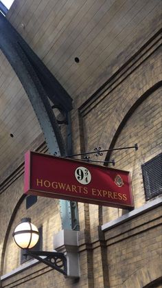 the hogwart's express sign is hanging from the ceiling