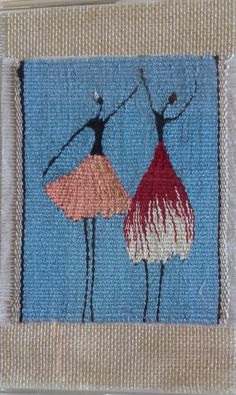 two people are dancing together on a piece of fabric, with one holding the other's hand