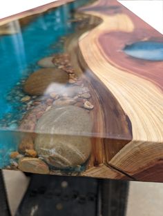 a table that has some rocks and water on it