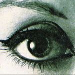 an eye with black and white makeup is shown